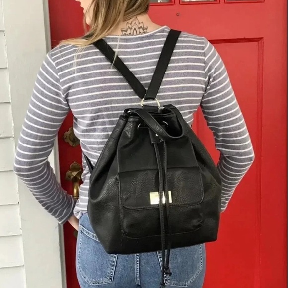 Juicy Couture Handbags - Sleek Black Leather Backpack with Adjustable Straps